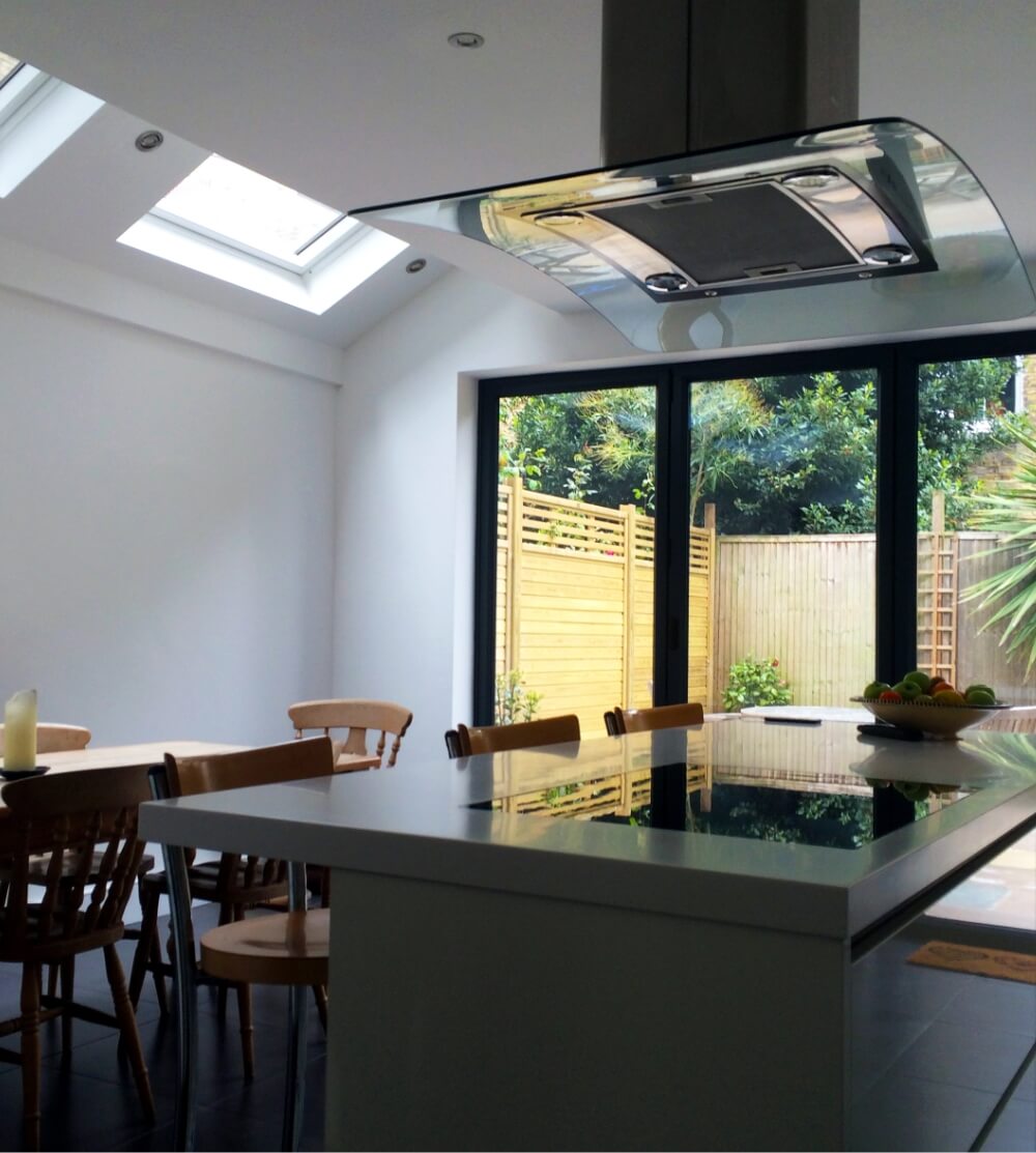 Loft dining room with glass door in south west london