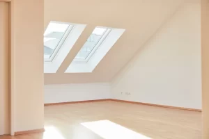 Bright-Empty-Room-in-Attic-Apartment-with-two-Windows-for-Natural-Light